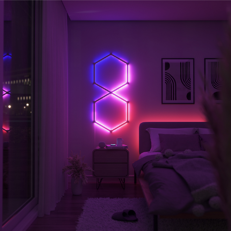 Nanoleaf Lines Thread enabled color changing smart modular backlit light lines mounted to a wall in a bedroom. HomeKit, Google Assistant, Amazon Alexa, IFTTT.